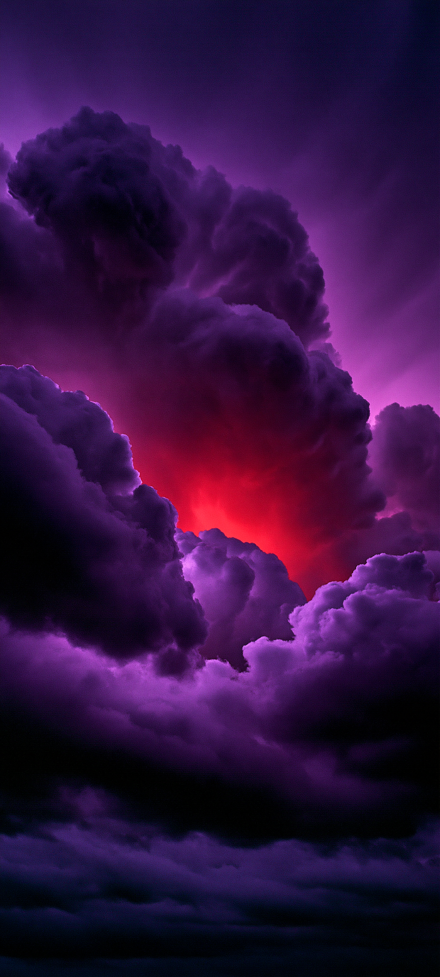 Dense purple storm clouds fill the frame with a bright red-orange glow breaking through the center against a violet sky.